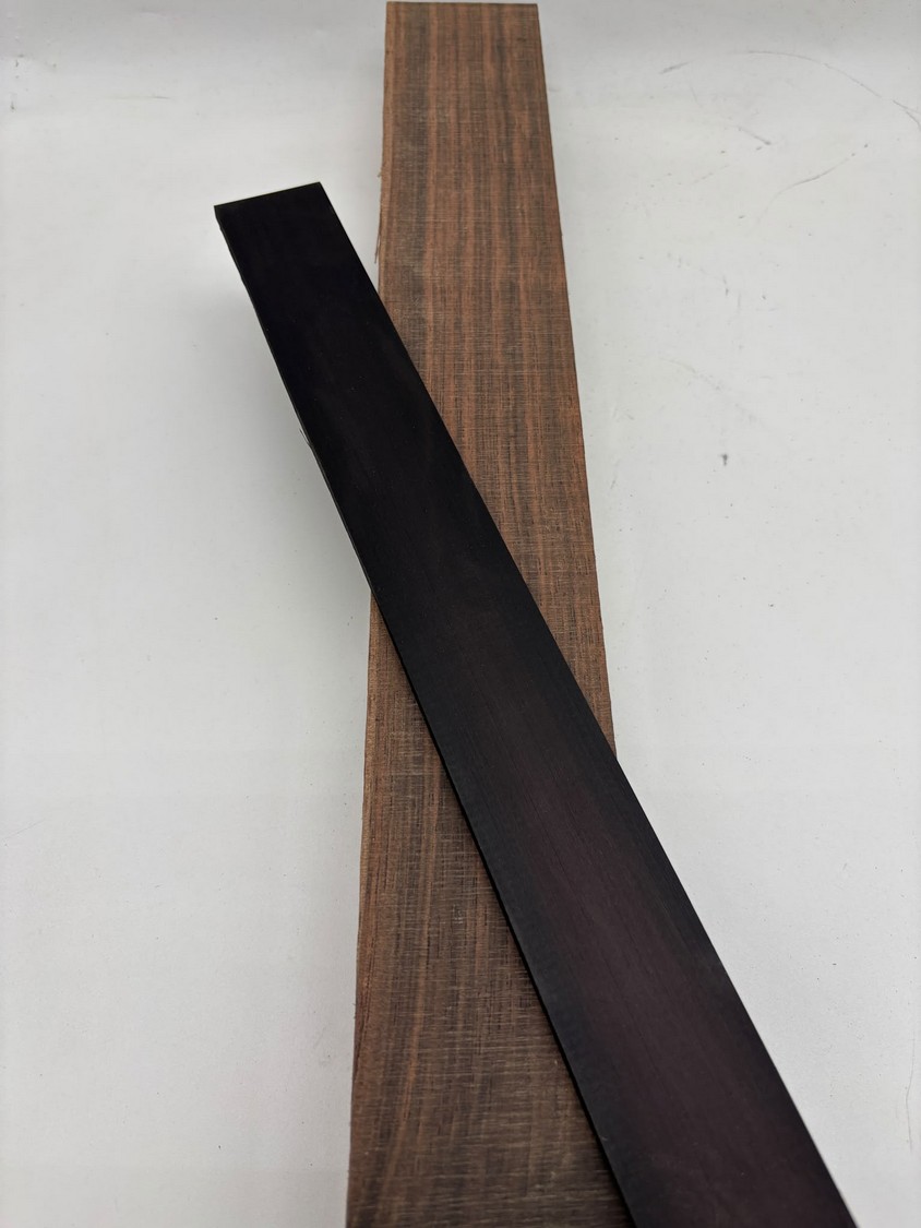 Black Hornbeam (left, narrow strip) alongside real ebony (right).