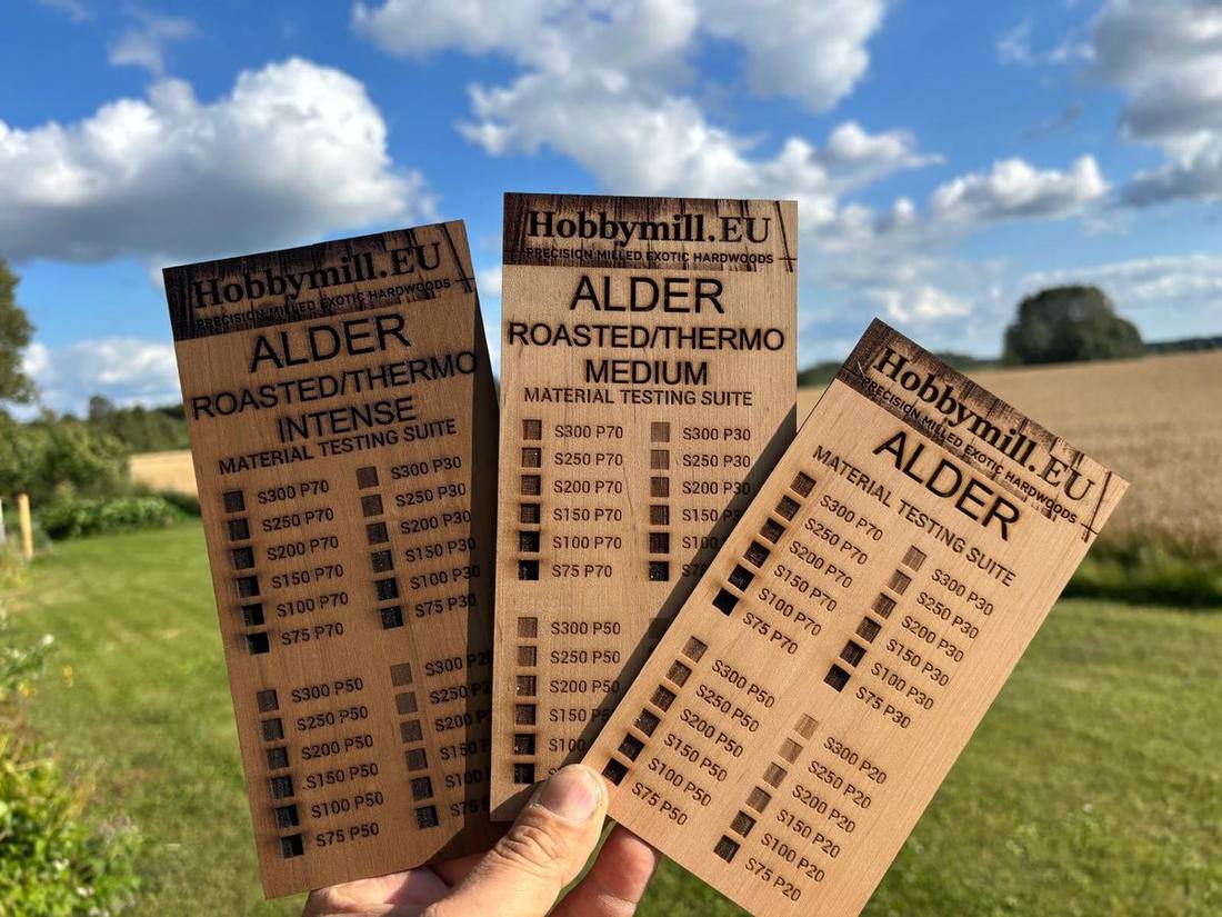 Three alder laser test cards side by side — roasted thermo intense, roasted thermo medium and natural alder
